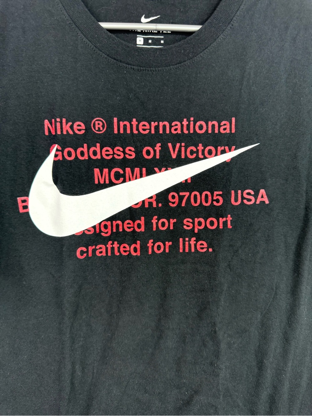 Nike Black Short-Sleeve Tee with White Swoosh and Red Text - Picture 3 of 6